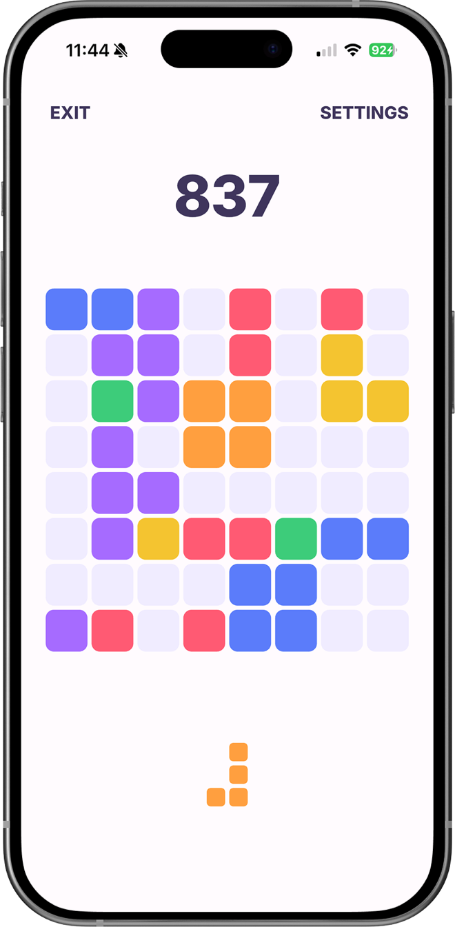 A game of Cubelo in progress, with coloured blocks filling the board